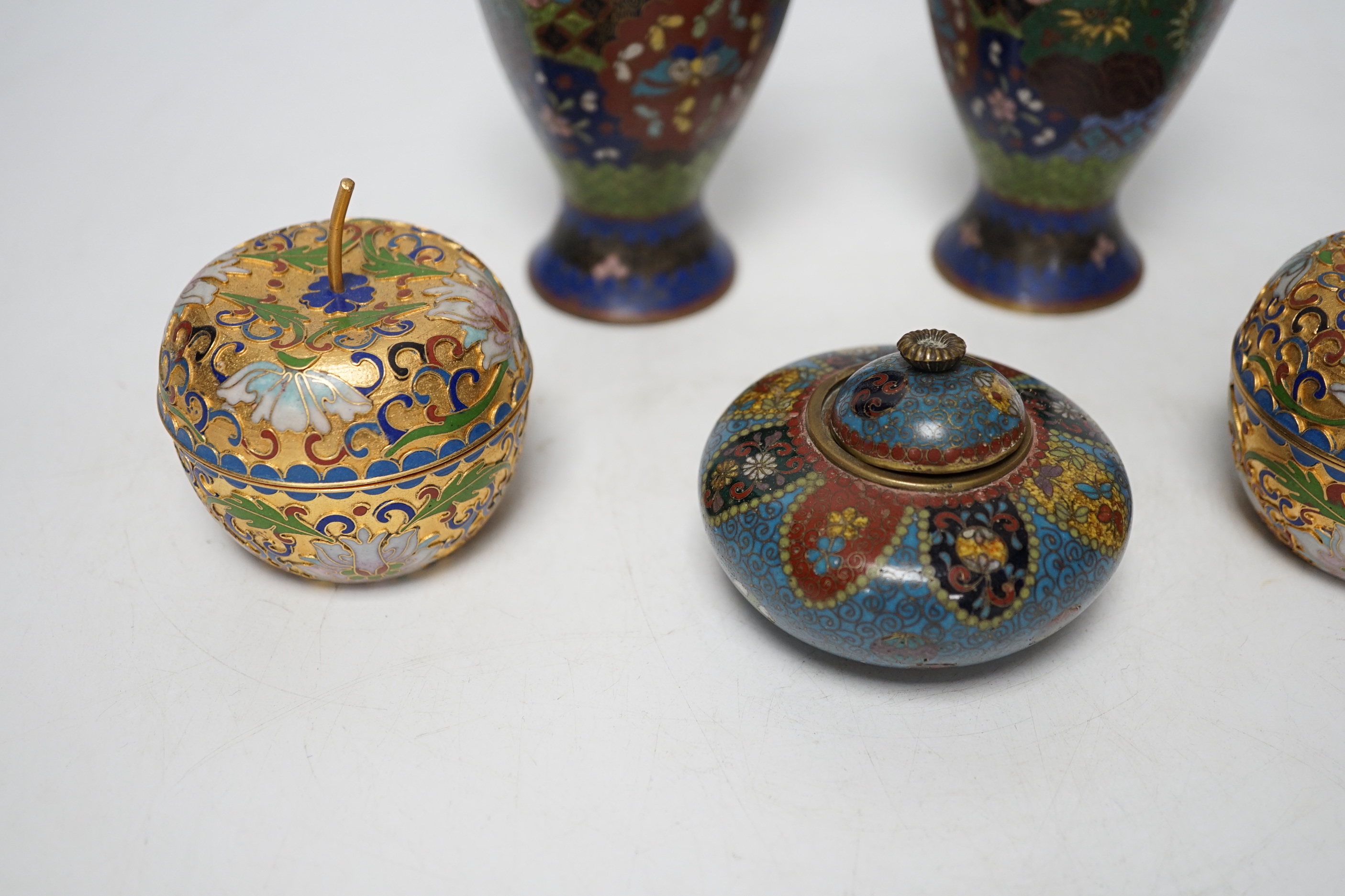 A pair of Chinese cloisonné enamel vases, similar Meiji period Japanese pot and cover and a pair of champleve ‘Apple’ boxes and covers, tallest 15cm